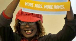 Jazzie Collins demonstrating for more jobs and more housing